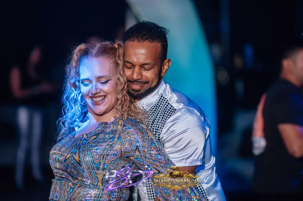 A couple dancing cheek to cheek